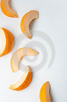 Top view of fresh and delicious melon slices on a white background. Summer fruit concept