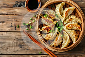 Top view fresh dumplings with hot steams on wood plate