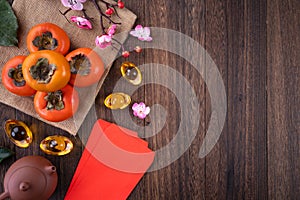 Top view of fresh persimmons on wooden table background for Chinese lunar new year