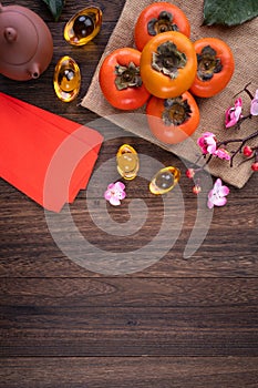 Top view of fresh persimmons on wooden table background for Chinese lunar new year