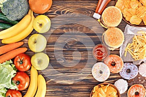 top view of fresh ripe fruits with vegetables and assorted junk food