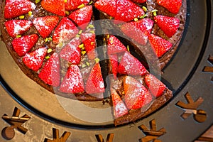 Top view on fresh selfmade baked strawberry cake