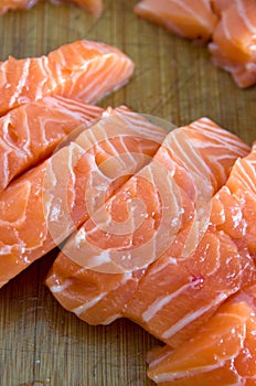 Top View of Freshly Cut Atlantic Salmon on Wood Board