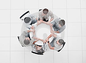 top view.friendly business team sitting at the round table