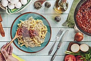 Top view of fusilli pasta with bolognese meat sauce