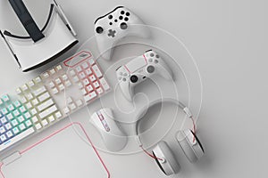 Top view of gamer workspace and gear like mouse, keyboard, joystick, headset, VR