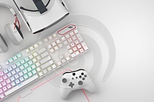 Top view of gamer workspace and gear like mouse, keyboard, joystick, headset, VR