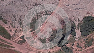 Top view of a garbage dump where machinery equals mountains of household waste, Ukraine. Ecological problem