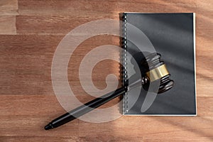 Top view gavel on wooden office desk background. equility