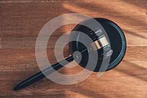 Top view gavel on wooden office desk background. equility