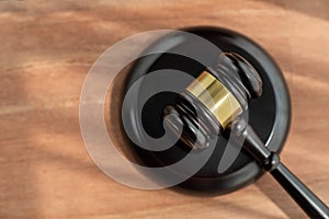 Top view gavel on wooden office desk background. equility