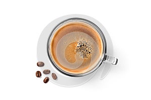 Top view of glass cup of espresso coffee and coffee beans isolated on white background