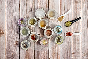 top view of glass spice jars on light