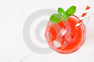 Top view of a glass of watermelon juice on a light background. copy space flat lay