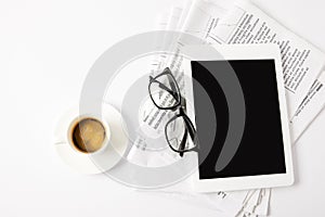 top view of glasses, cup of coffee, digital tablet and pile of newspapers, on white