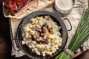 Top view of the gnocchi with cheese food halusky with sour milk and a bunch of chives