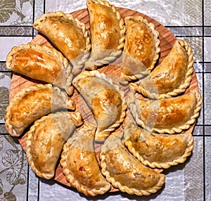 Top view of golden delicious empanadas, a traditional meal in Argentina.