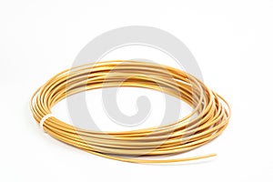 Top view of golden rolled filament plastic for 3D Printing Pen isolated on white