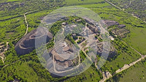 Top view of granite quarry, sand piles and crushing equipment quarry