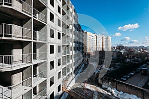 Top view on gray concrete panels of an apartment building on a sunny day