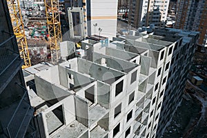 Top view on gray concrete panels of an apartment building on a sunny day