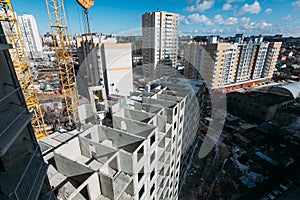 Top view on gray concrete panels of an apartment building on a sunny day