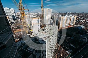 Top view on gray concrete panels of an apartment building on a sunny day