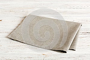 top view with gray kitchen napkin isolated on table background. Folded cloth for mockup with copy space, Flat lay