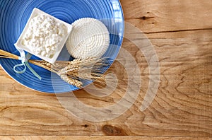 Top view of greek cheese and cottage on wooden table. Symbols of jewish holiday - Shavuot