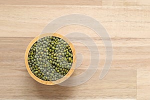 Top view of green beans in a bowl on wooder background, Healthy eating concept