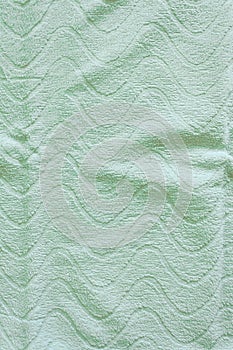 Top view of Green Towel texture. Green Towel Fabric Texture Background. Close-up. Green natural cotton towel background.