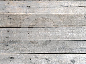 top view of grey hardwood panel of pier walkway floor