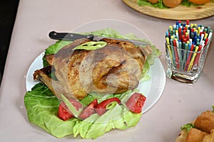 Top view of grilled Chicken with seasonal lettuce salad