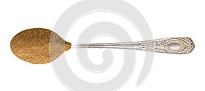 Top view of ground roasted chicory root in spoon