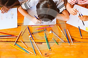 Top view of group asian children drawing and painting