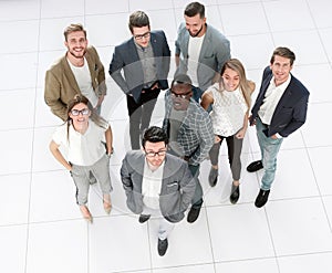 Top view. a group of creative young people standing in the office.