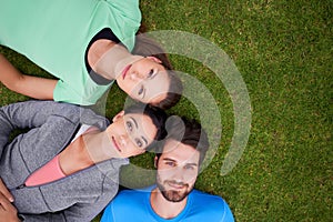 Top view, group of people on grass and portrait for fitness, relax after workout for health and wellness together