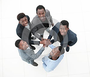 Top view . a group of young entrepreneurs showing their unity