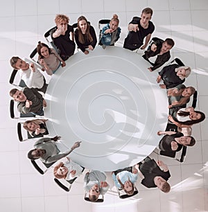 top view. a group of young people applaud at a group meeting
