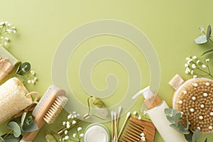 Top view of gua sha tool, cream, loofah, handmade soap, anticellulite brush, eucalyptus and more
