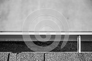 Top view of a gutter system on a residential house.  Asphalt shingles and support brackets visible