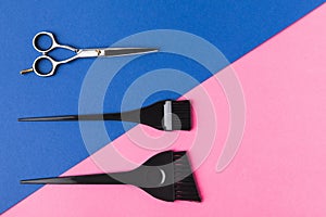 top view of hairdressing tools, on pink and blue