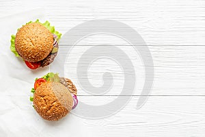 Top view of hamburgers with beef meat steak and vegetales photo