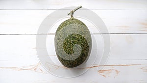 top view of hami melon on white wooden table