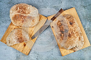 Top view of handmade gingerbread on wooden boards with a knif