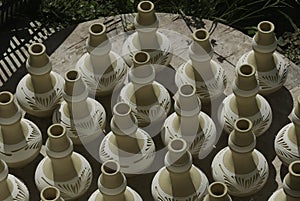 Top view of handmade traditional Malay craft known as `labu sayong` dry in the sun. It is a hand made water storage container.