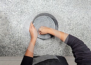 Top View of hands greasing a cake mould in the kitchen