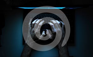 Top view of the hands of a programmer on  his laptop