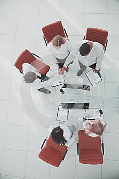 Top view.the handshake business partners at a business meeting.