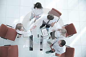 Top view.the handshake business partners at a business meeting.